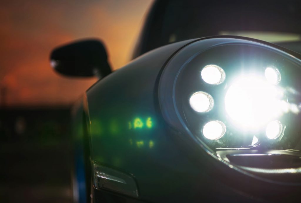 pass mot, a closeup of a car headlight
