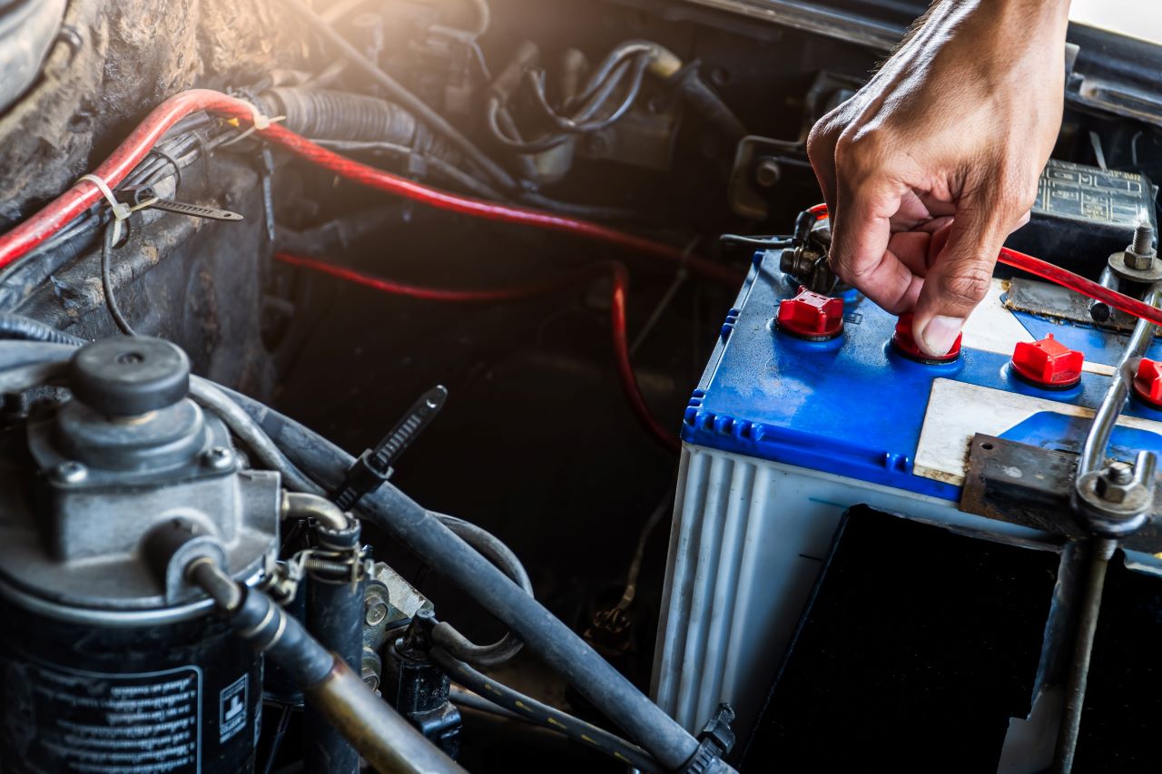car battery maintenance, Hand worker service checking car battery